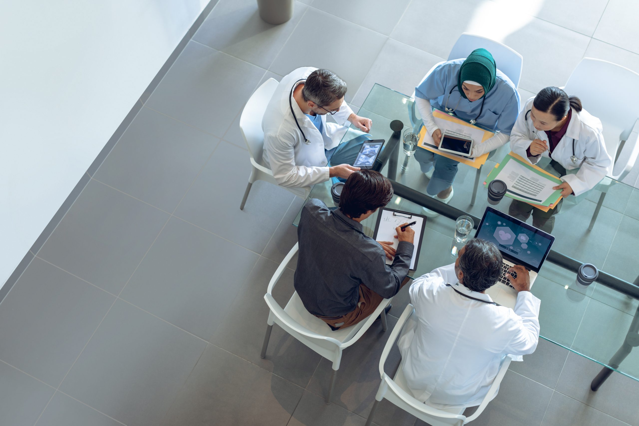 high-angle view of a diverse medical team engaged in a discussion