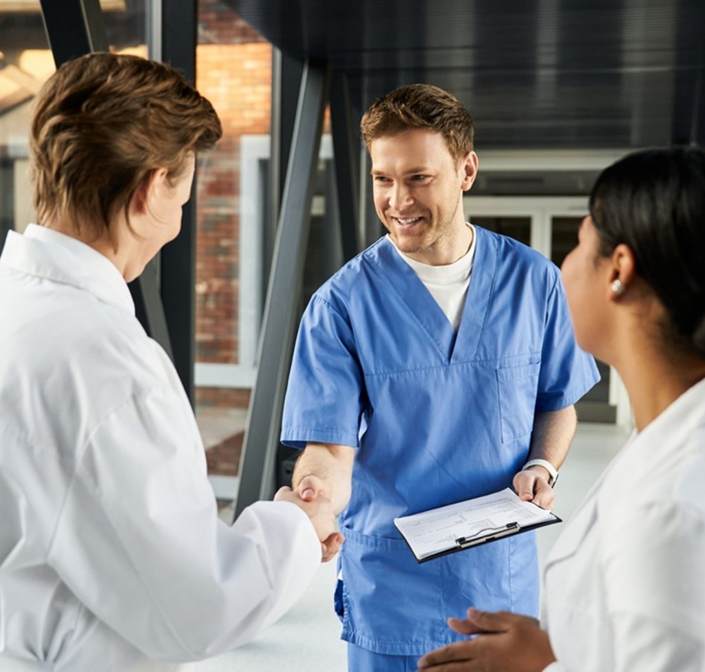 hospital quality director shaking hands with CRS clinical data abstraction services representative